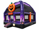 Angled view of the Haunted Castle Bongo Bounce House showing the purple frame, mesh walls and striped entry step